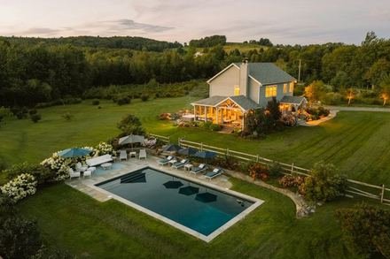 Sample listing: a house with a large pool seen from above, surrounded by lawn