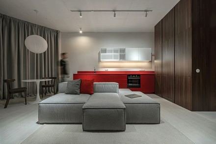 Sample listing: an open loft living room with a gray sofa